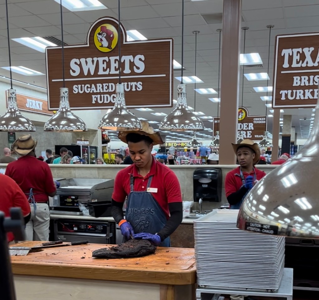 Buc-ee's employee carves their famous brisket for sandwiches. The chain has launched the Buc-ee's Summer Road Trip Challenge