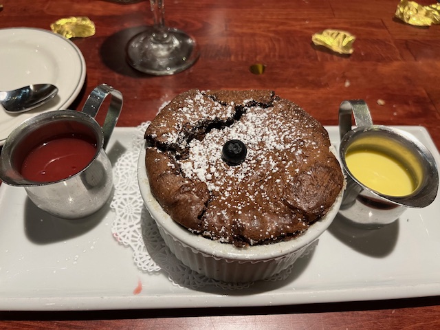 Chocolate Souffle with raspberry and creme anglaise. The chef at the Brentwood will be featured on Chef Swap At The Beach