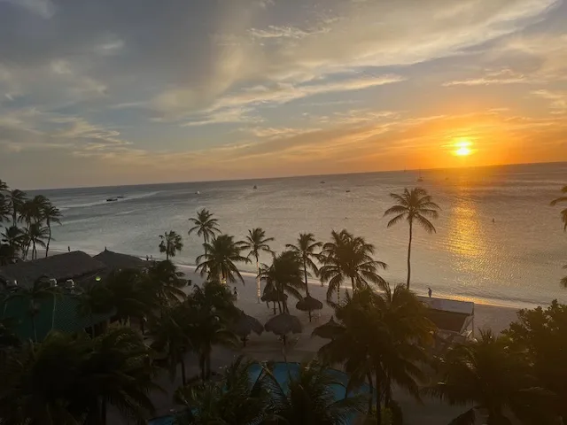 a sunset in Aruba one of the top travel destinations for summer