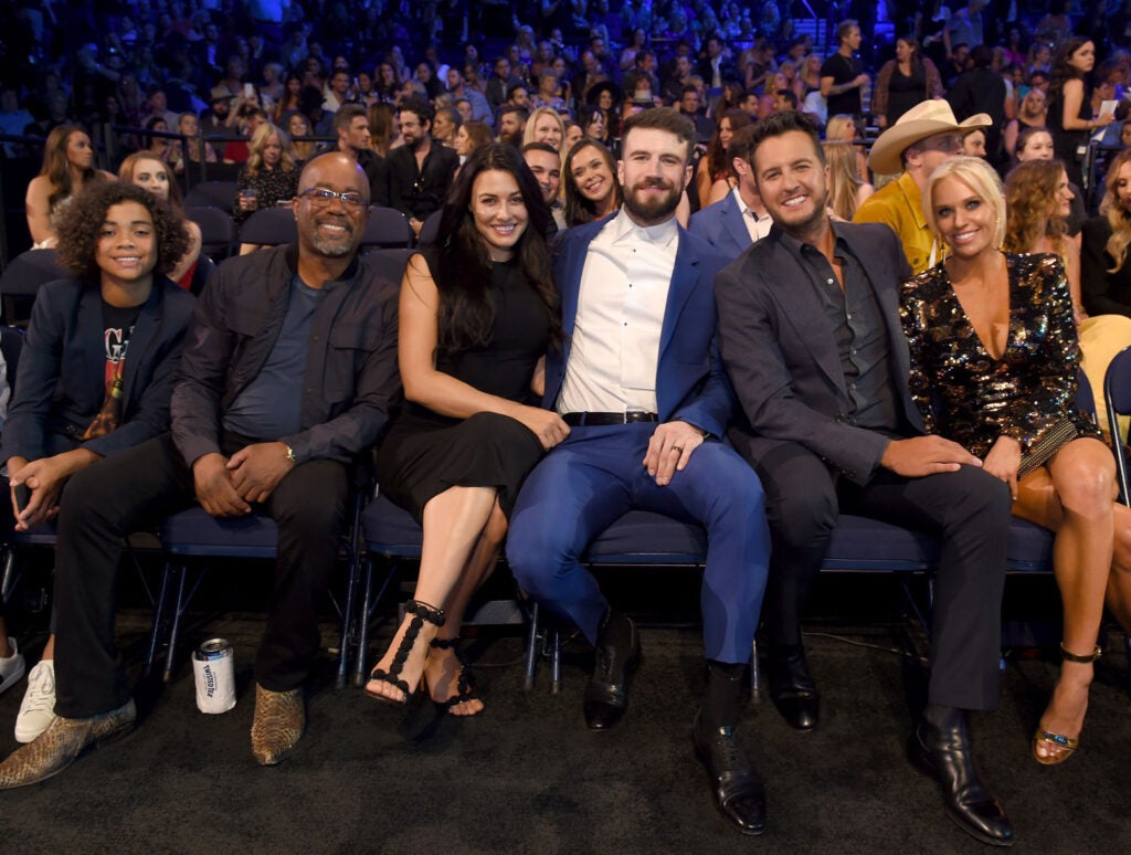 Sam Hunt Is Working To Heal - Sam and his wife Hannah with Darius Rucker and Luke Bryan and his wife sitting at a Nashville award show. 